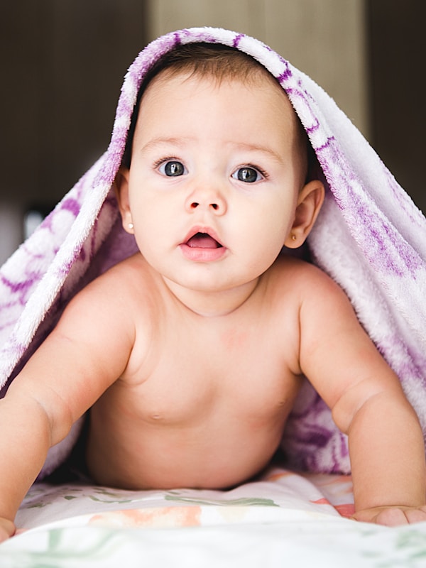 Child playing with colourful building blocks
